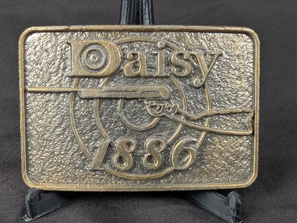 Vintage Daisy 1886 Brass Belt Buckle Manufactured by Astamar Boston Advertising